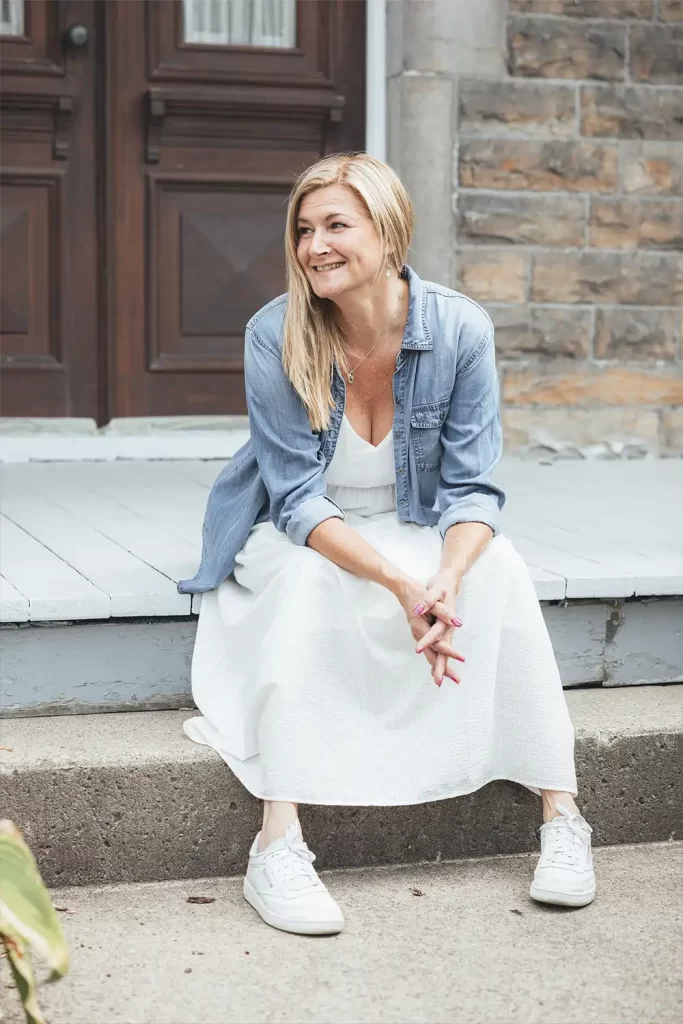 Portrait of a woman sitting on a porch stairs