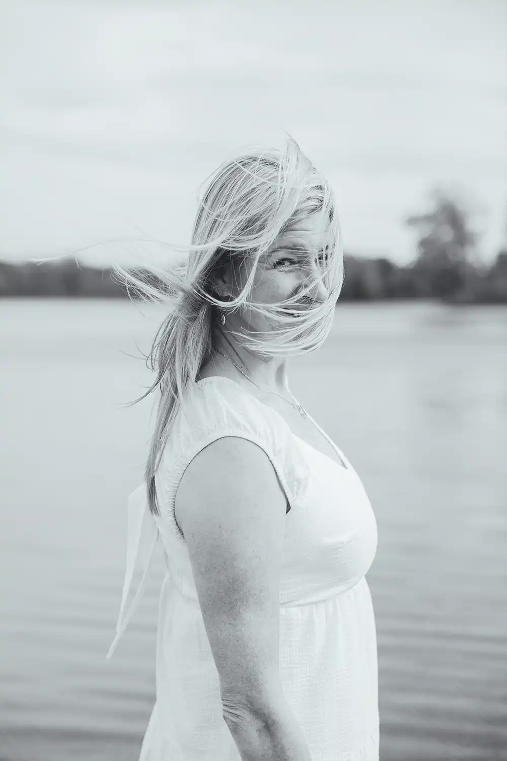 Portrait of a woman standing at the river