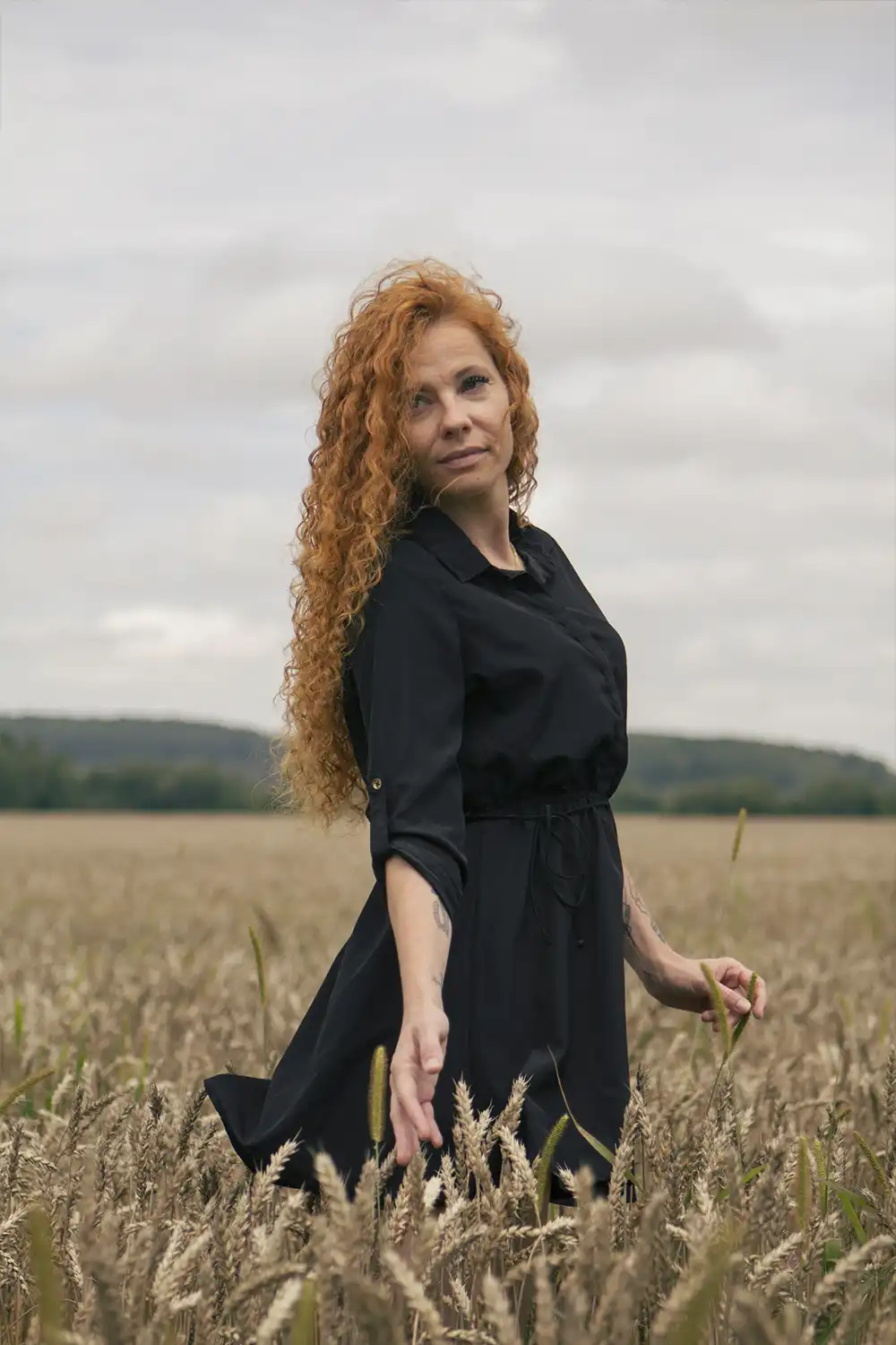 Portrait of a woman walking in a field